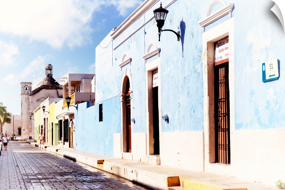 Photograph of a Campeche street view with a light blue building in front. From the Viva Mexico Collection.