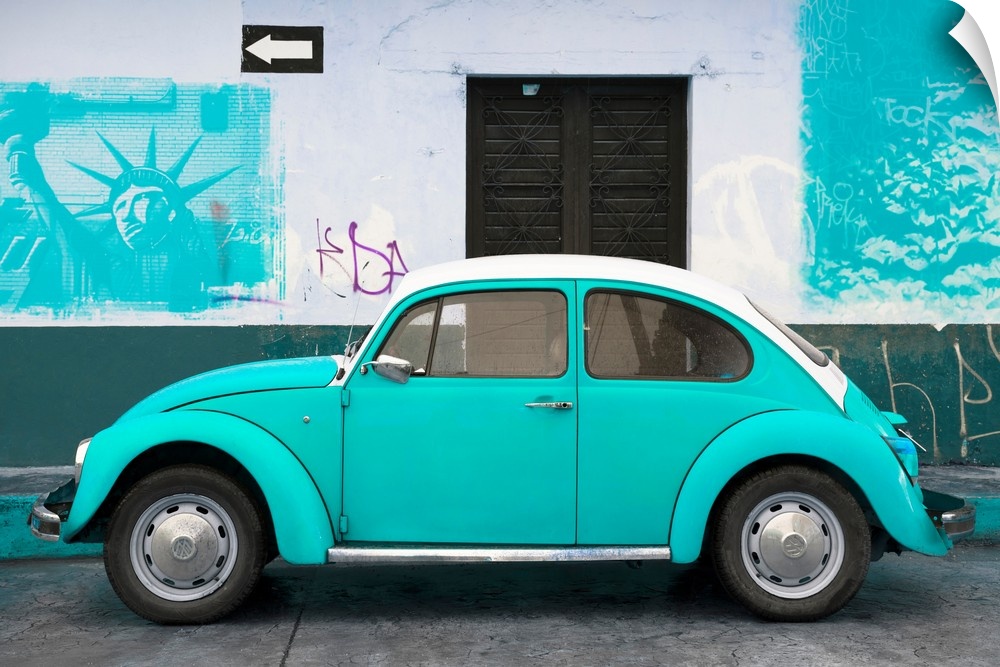 Photograph of a pink Volkswagen Beetle parked in front of a wall covered in light blue American graffiti, Mexico. From the...