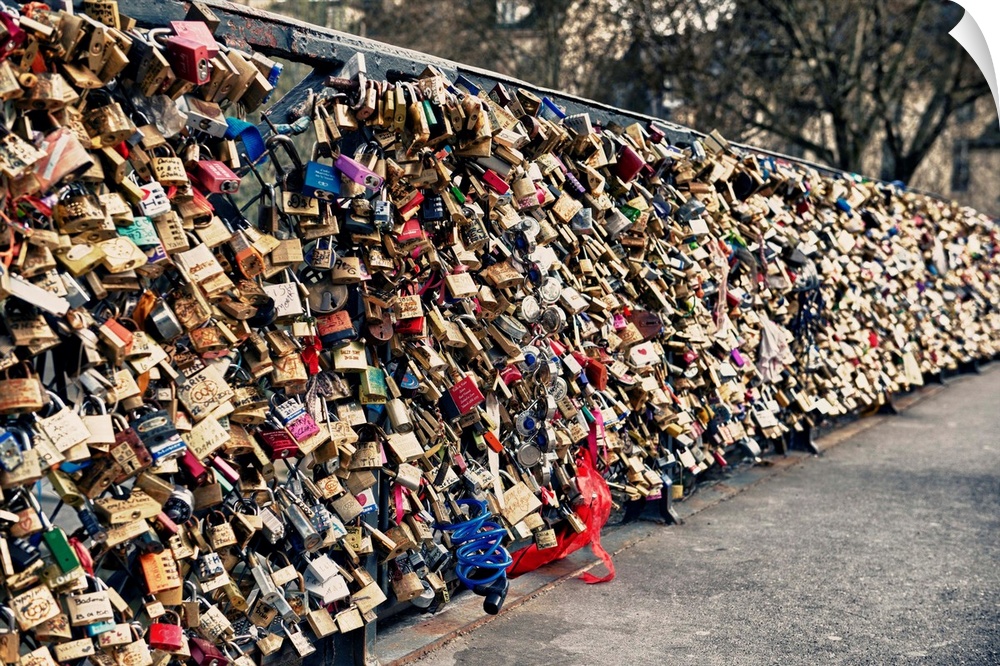 Collection of locks left by couples on the Pont des Arts in Paris, France.