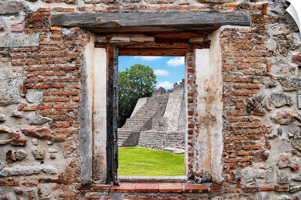 View of a Mayan Pyramid framed through a stony, brick window. From the Viva Mexico Window View.