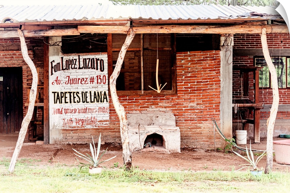 Photograph of a building where woven wool rugs (tapetes de lana) are made. From the Viva Mexico Collection.