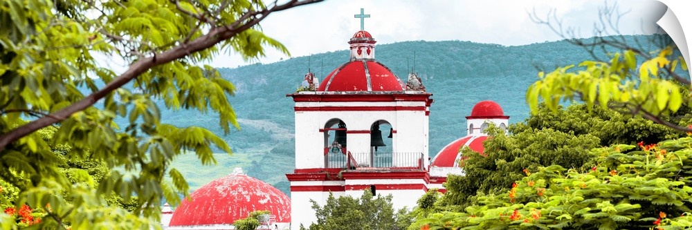 Panoramic photograph of the top of a red and white church in Mexico. From the Viva Mexico Panoramic Collection.
