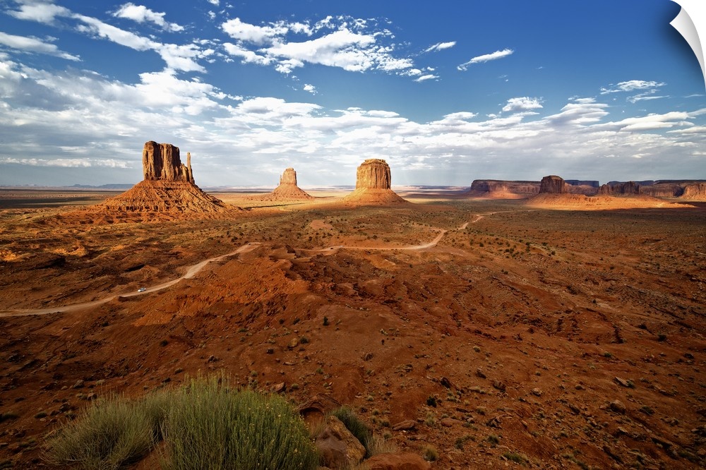 Large rock formations in the desert landscape of Monument Valley.