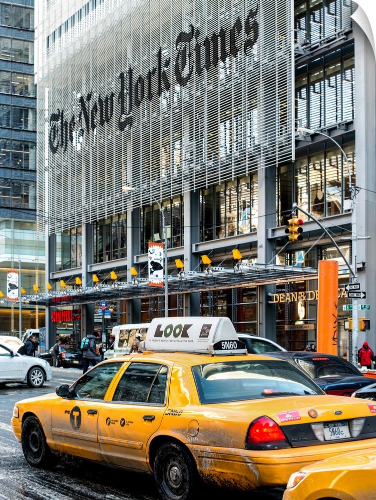 A photograph of NYC taxi's in front of the New York Times building.