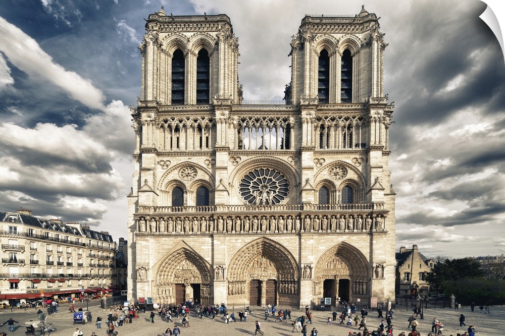 Fine art photograph of the front of the Notre Dame of Paris Cathedral with a vivid sky.