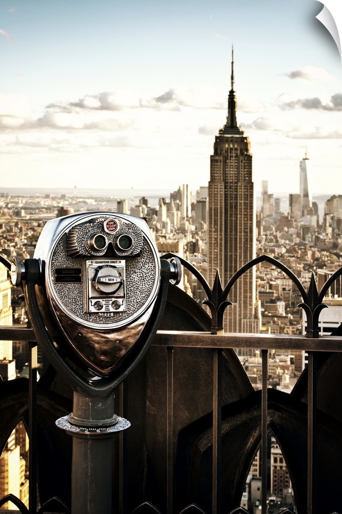 Fine art photo of coin operated binoculars on the observatory of a building, with the Empire State Building in the distance.