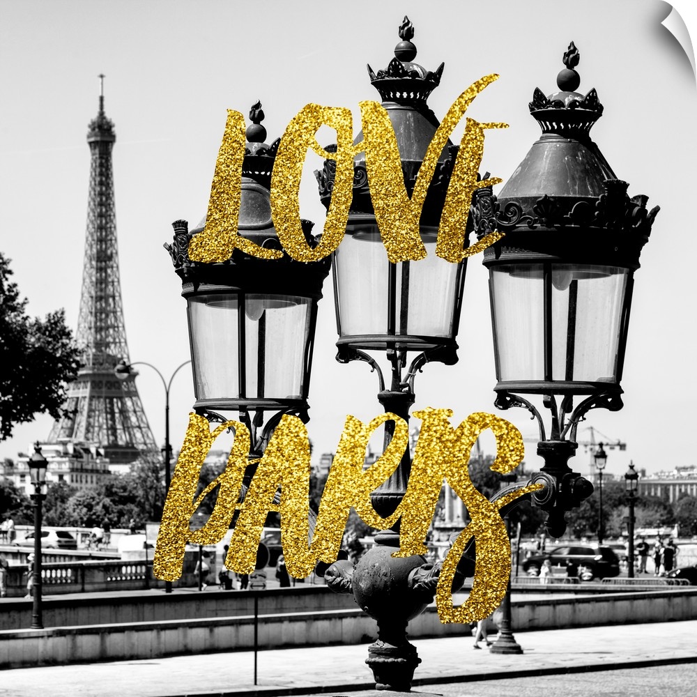 Black and white photograph of a lamppost with the Eiffel Tower in the background and the phrase "Love Paris" written in go...
