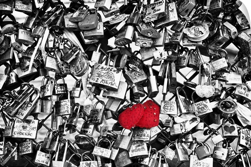 Collection of locks left by couples on the Pont des Arts in Paris, France, with selective coloring.
