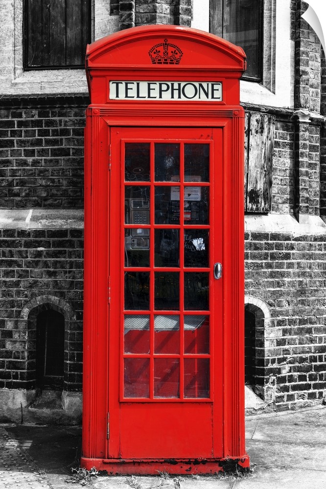 Fine art photo of an iconic red telephone booth on a London street corner.