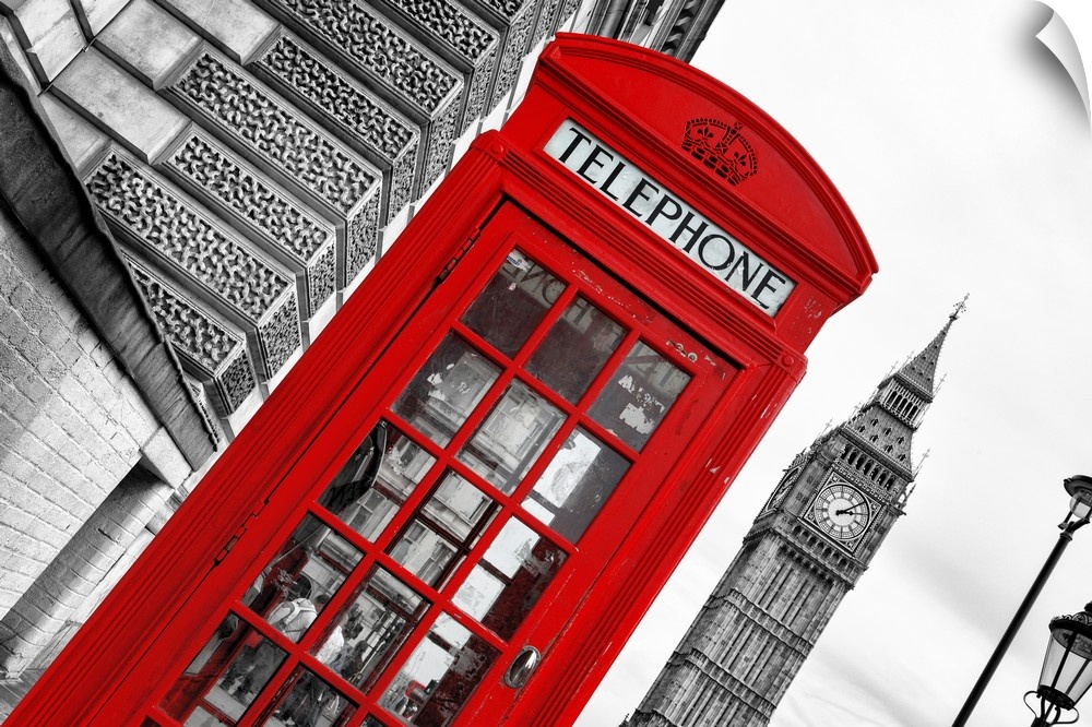Angled photo of a red telephone booth with the Big Ben clock tower in the background.