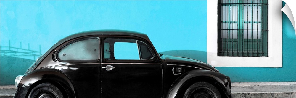 Panoramic photograph of a classic black Volkswagen Beetle parked in front of a bright turquoise wall. From the Viva Mexico...