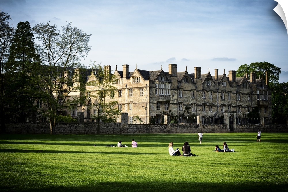 Fine art photo of students on the lawn at the University of Oxford.