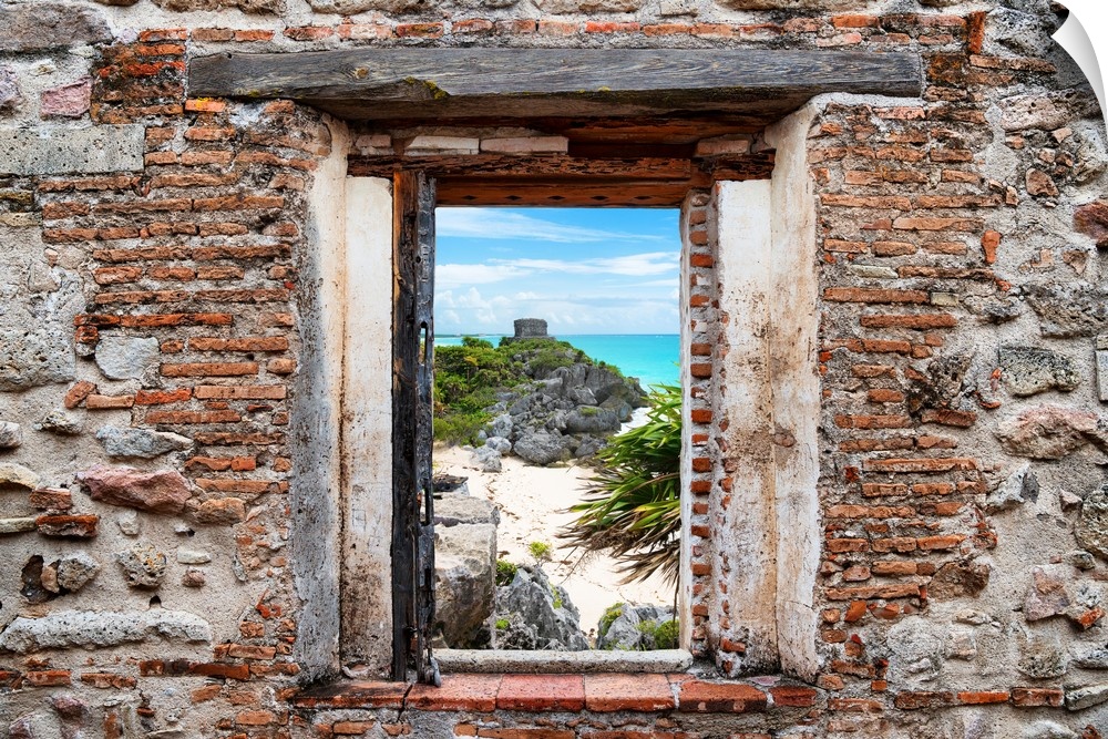 View of the Tulum ruins along Caribbean coastline framed through a stony, brick window. From the Viva Mexico Window View.