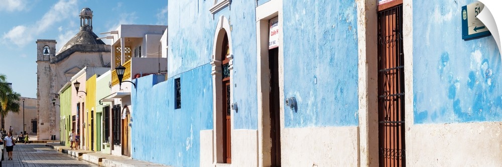Panoramic photograph of a street scene in Campeche, Mexico, with a bright blue building. From the Viva Mexico Panoramic Co...