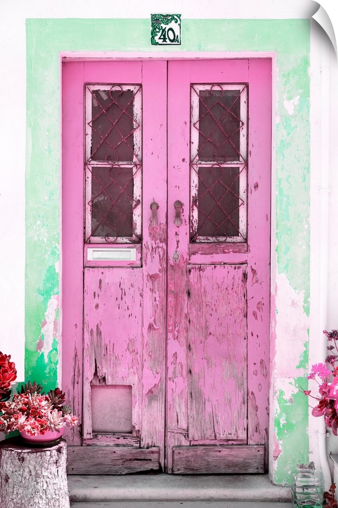 It's an old pink door entrance to a traditional house in Portugal.