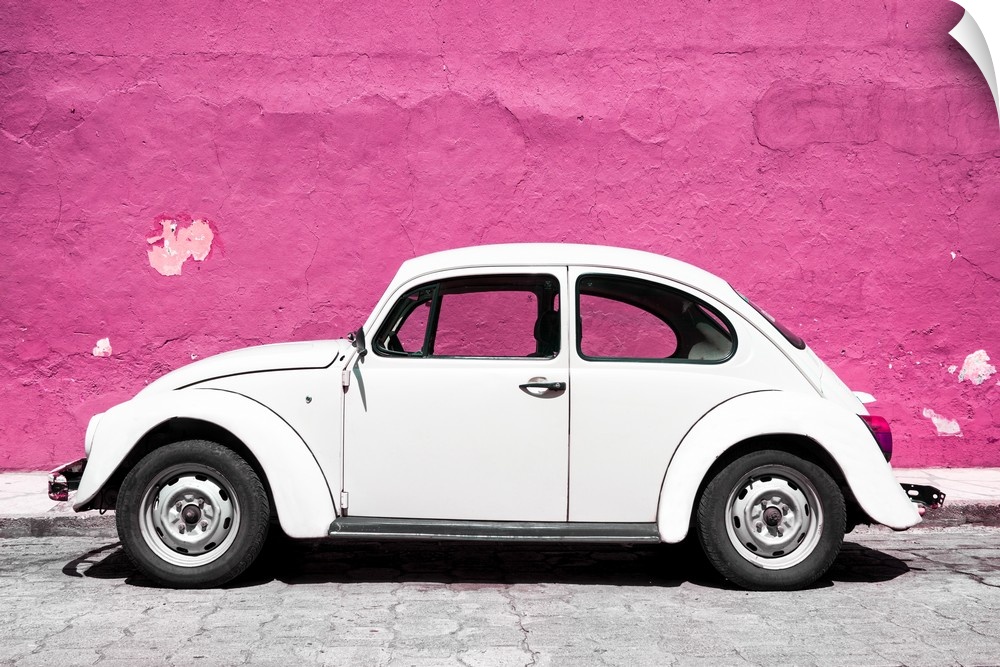 Photograph of a class white Volkswagen Beetle parked in front of a bright pink wall in Mexico. From the Viva Mexico Collec...