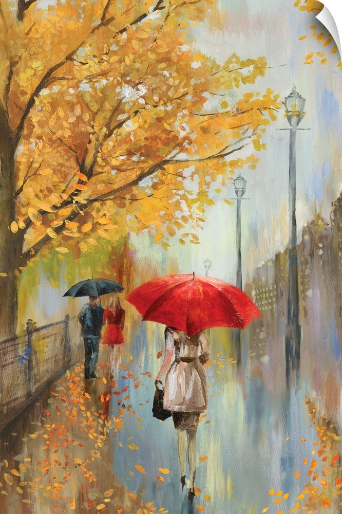 A rainy fall scene of people walking on a sidewalk along a park in a city.