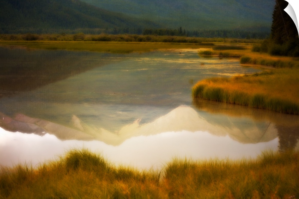 A photograph of a mountain reflection in a lake with a distressed overlay to the photo.