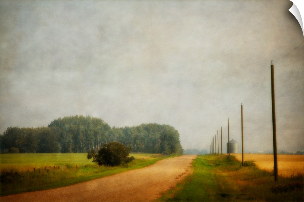A distressed photo of country landscape with a silo in the background.