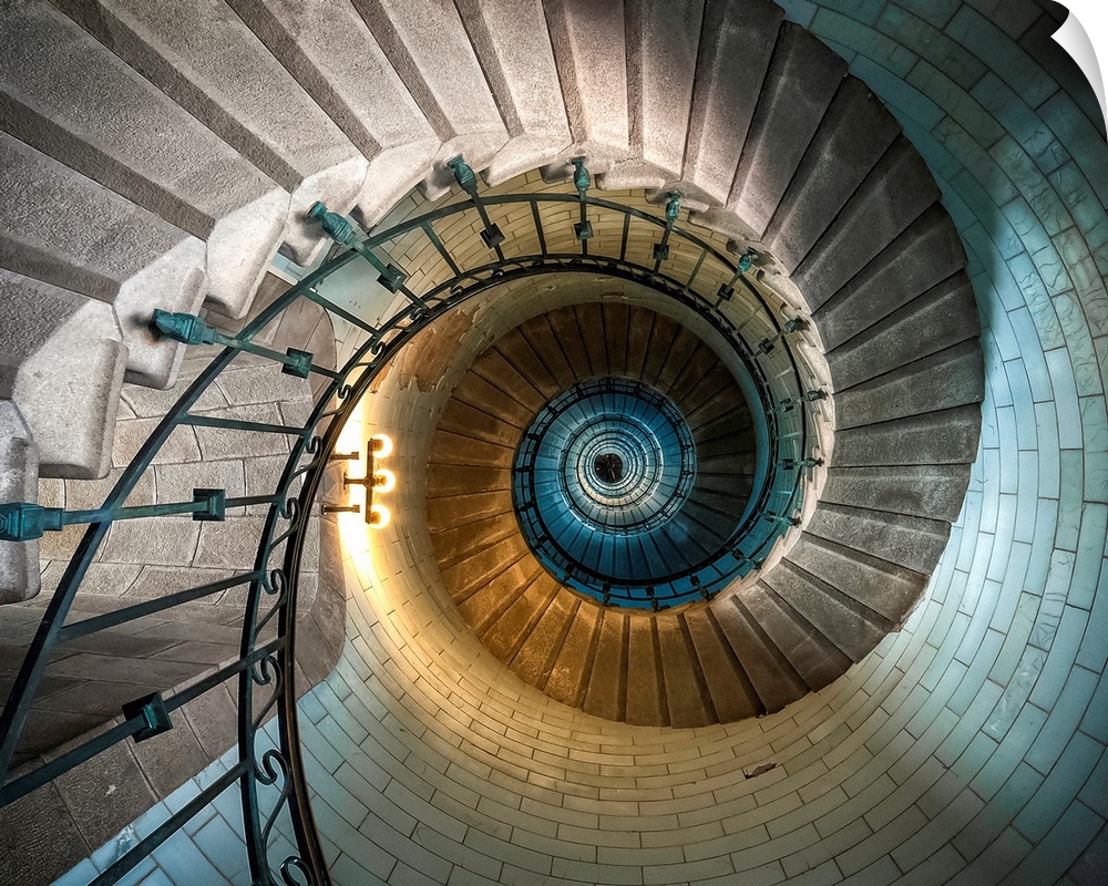 Old spiral staircase in the center of a lighthouse.