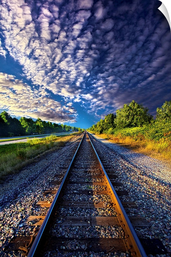 Dramatic cloudscape over railroad tracks in the countryside of Wisconsin.