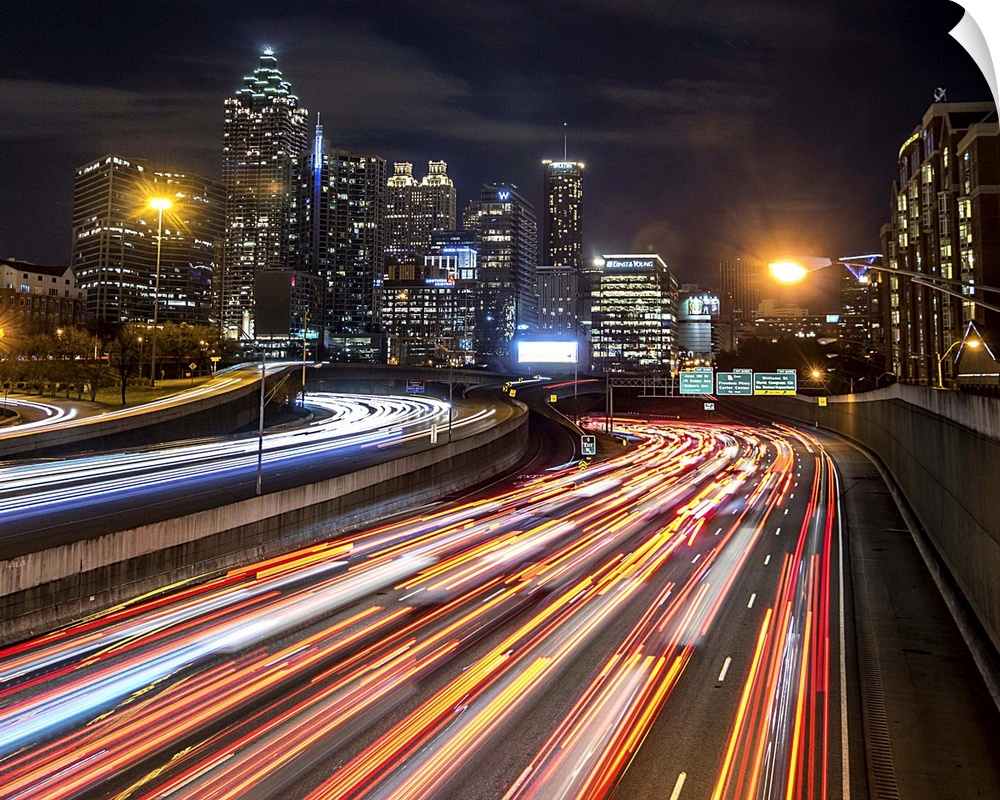 Light trails from traffic leading into the city of Atlanta, Georgia, at night.