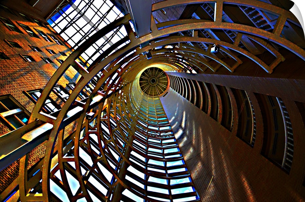 Photograph looking up through a tunnel up to an atrium.