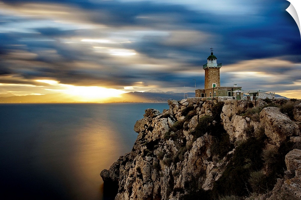 A lighthouse on a rocky cliff, Corinthia, Greece.