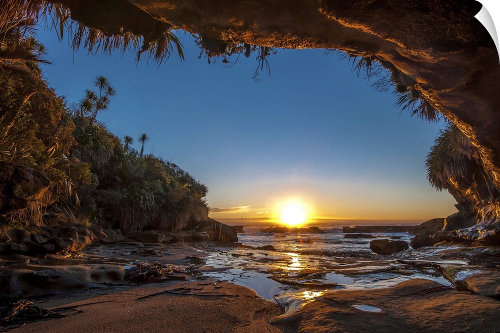 Sunset on the ocean from a cave on the New Zealand coast.