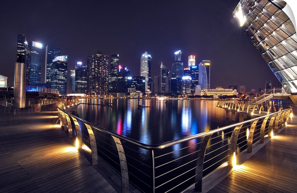 Singapore city skyline lit up at night with neon lights.