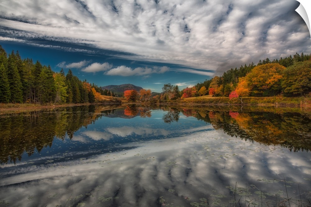 Rippling clouds in the sky above Acadia National Park, mirrored in the lake below.