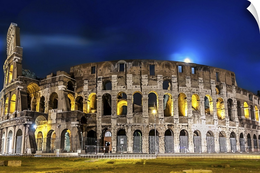 The Colosseum in Rome lit up at night.