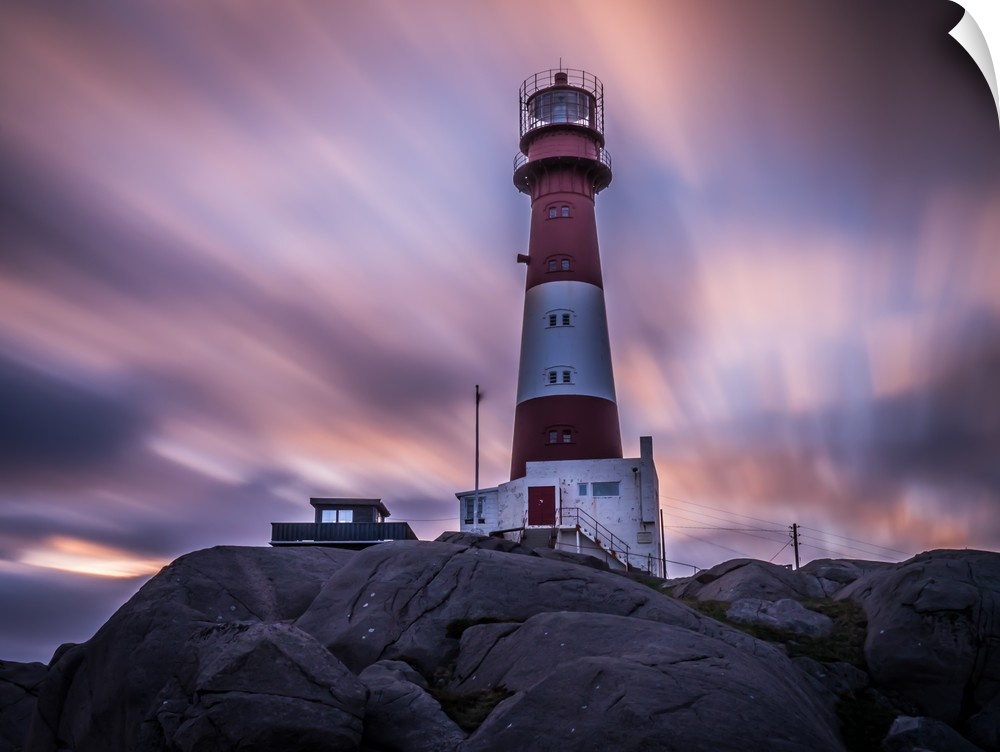 Lighthouse on the coast at Eigeroya, Norway, at sunset.