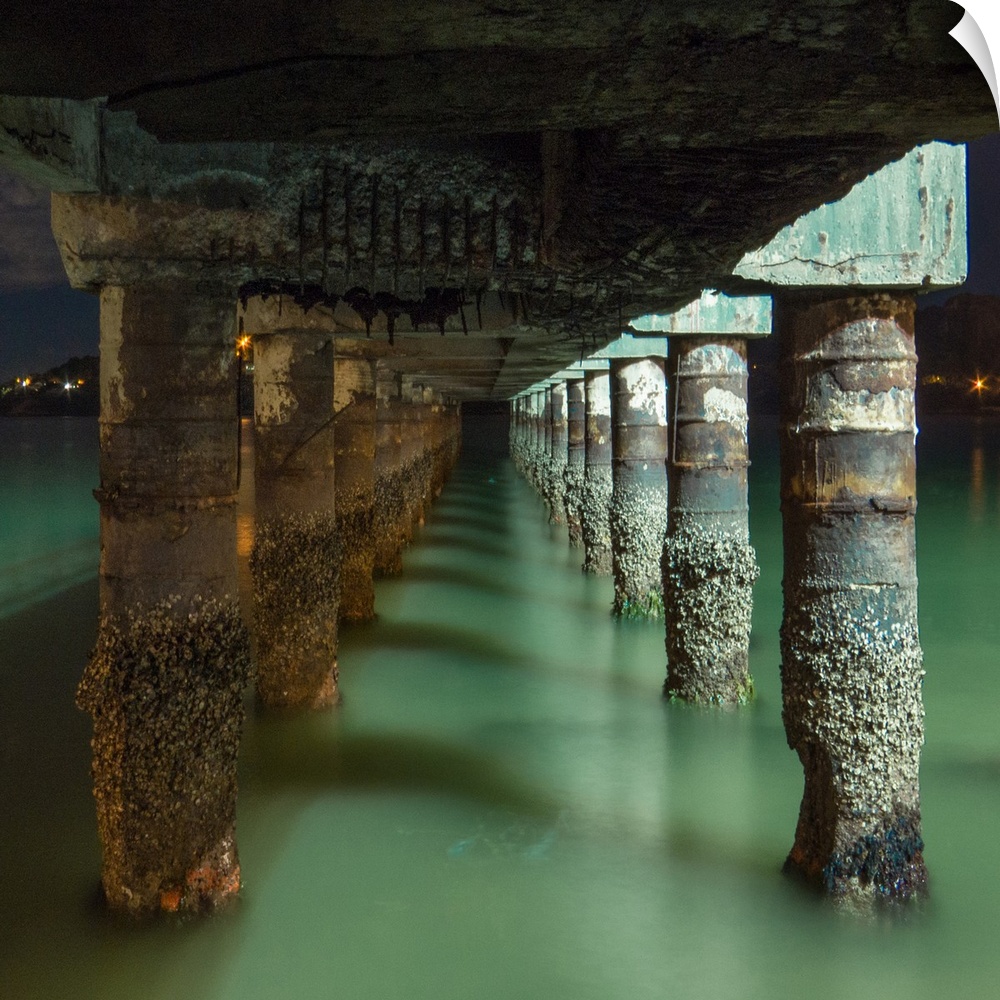 Under a pier in a small portuary city in Brazil.