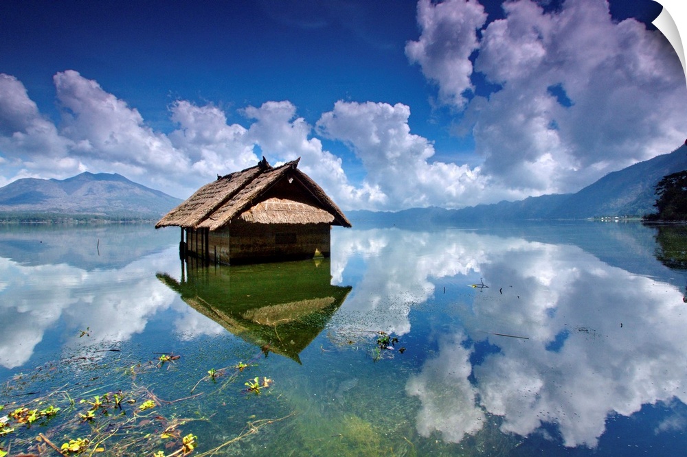 A houseboat on a clear blue lake, Batur Lake, Kintamani, Bangli, Bali, Indonesia.