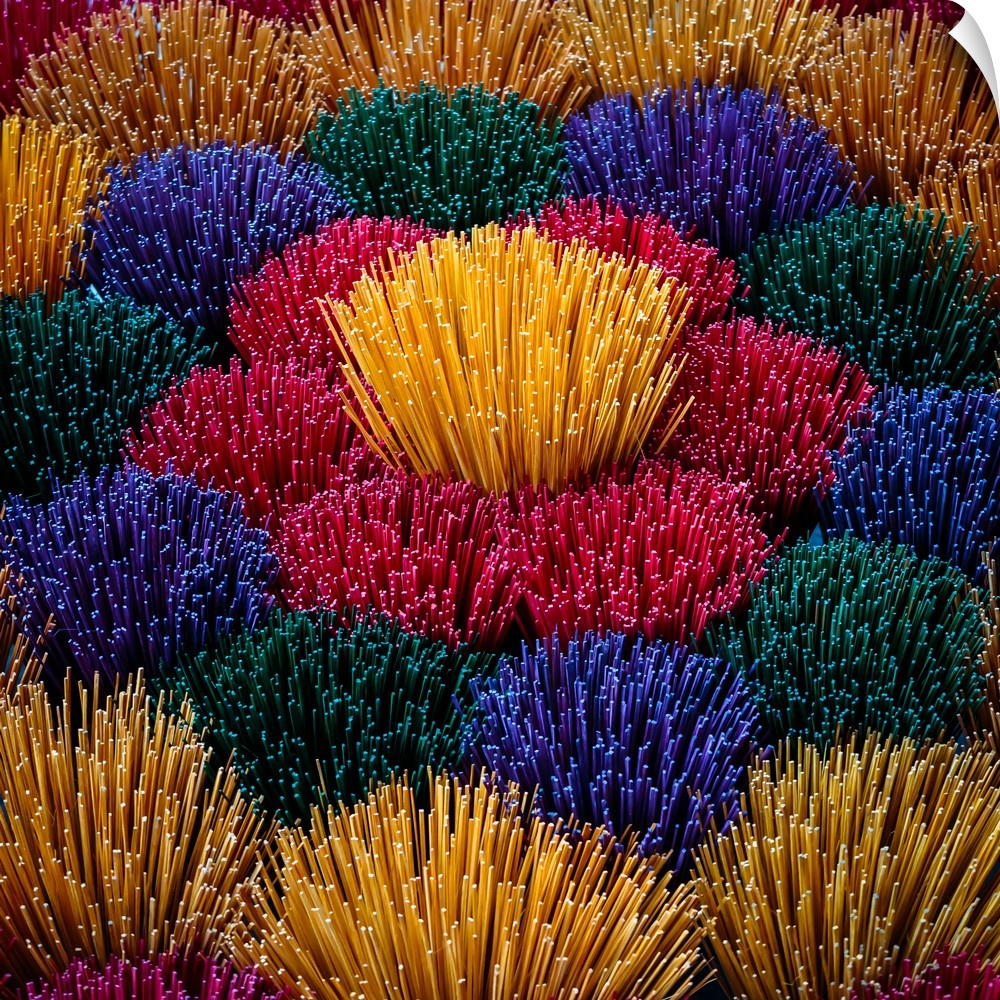Colourful incense sticks for sale at a market in Vietnam.