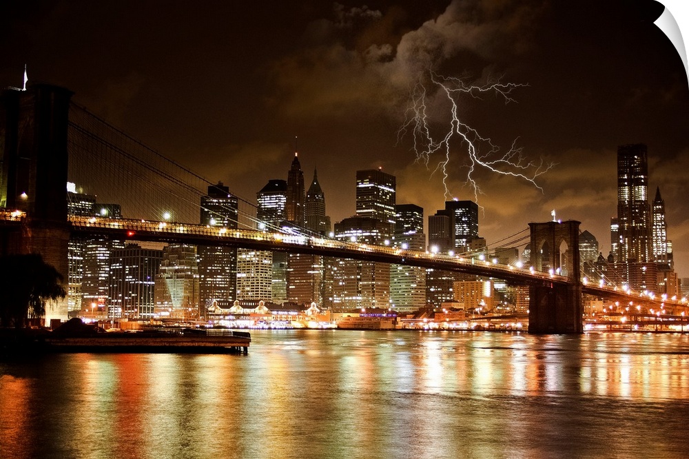 Night shot of the Brooklyn Bridge and Manhattan skyline at night under a bolts of lightning.
