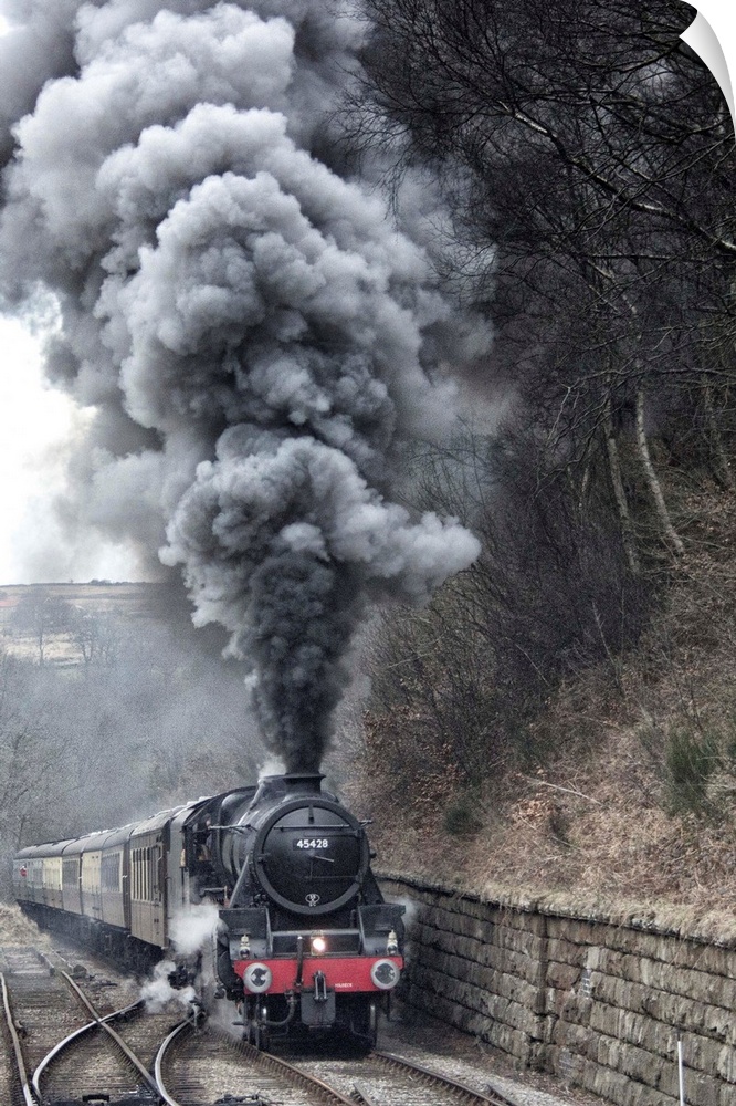 Lots of steam from a locomotive's smokestack.