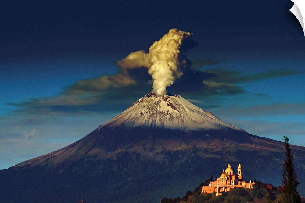 Smoking Popocatepetl volcano in Mexico in the dawn light.