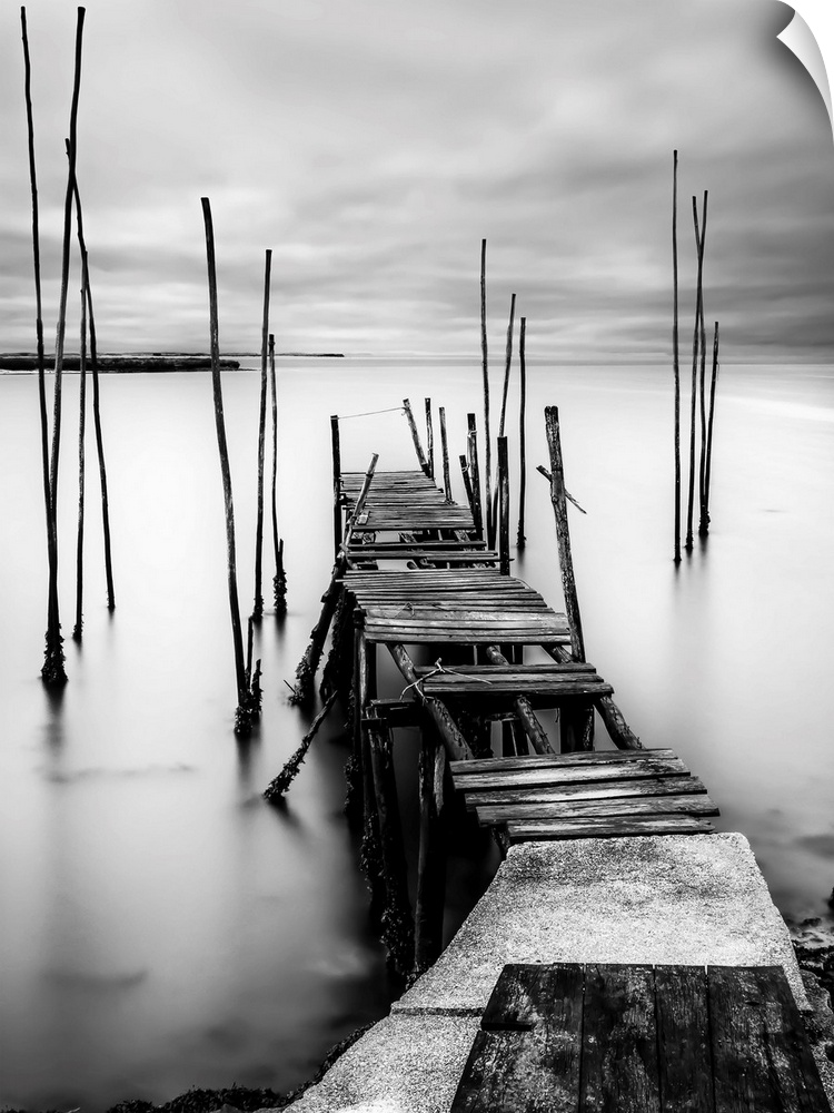 A worn out old pier with missing planks.