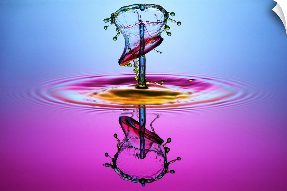A droplet forming an abstract shape as it splashes into the water.