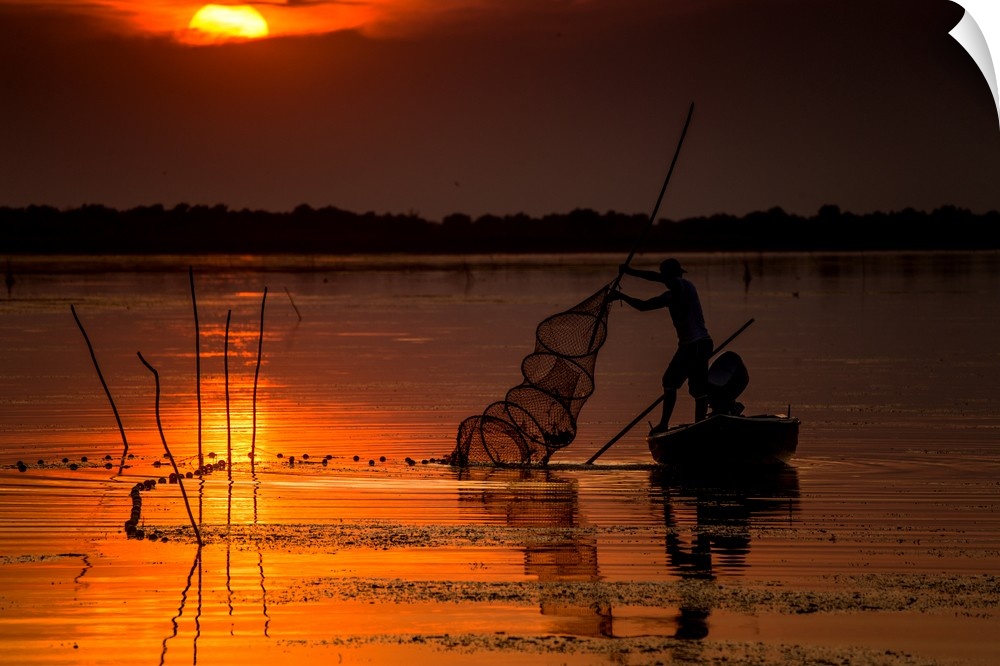 A fisherman from Danube Delta, Romania at sunset.