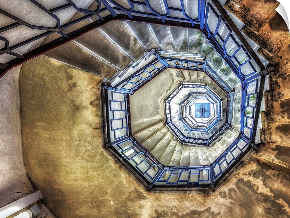 Spiral staircase inside a lighthouse in Italy.