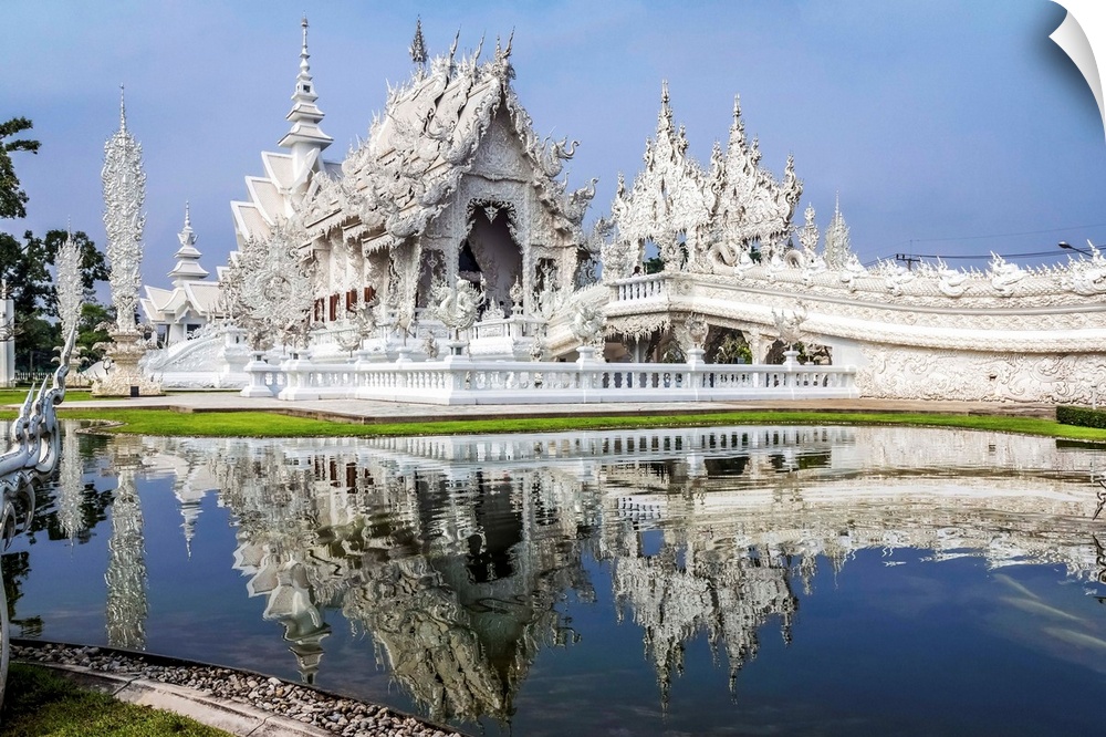 Beautiful Wat Rong Khun temple on the water, Thailand.
