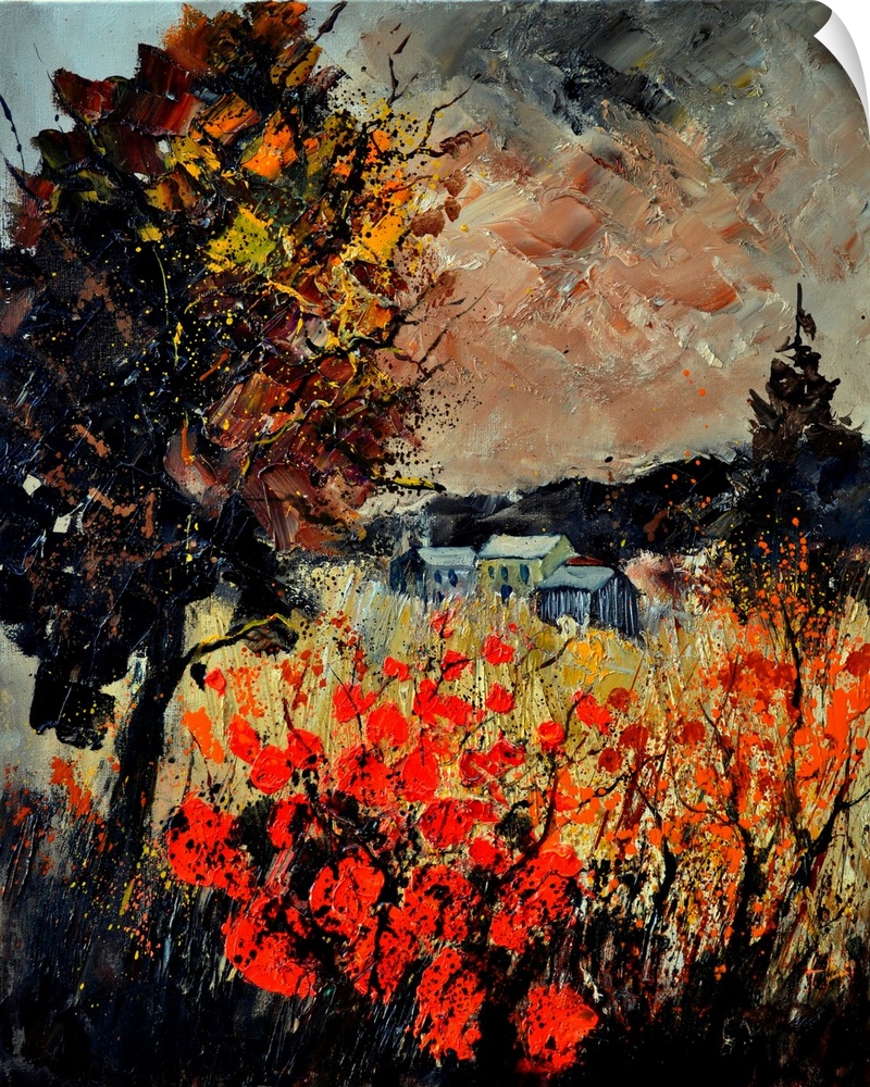 An autumn scene of red blooming flowers in a field near a small village.