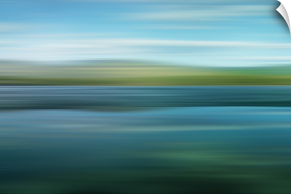 An artistic photograph of a horizontal blurred landscape of a green mountainscape.