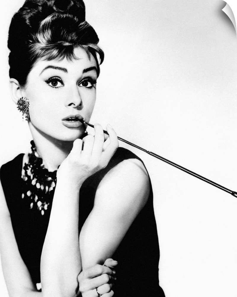 Black and white photograph of Audrey Hepburn from Breakfast at Tiffany's.