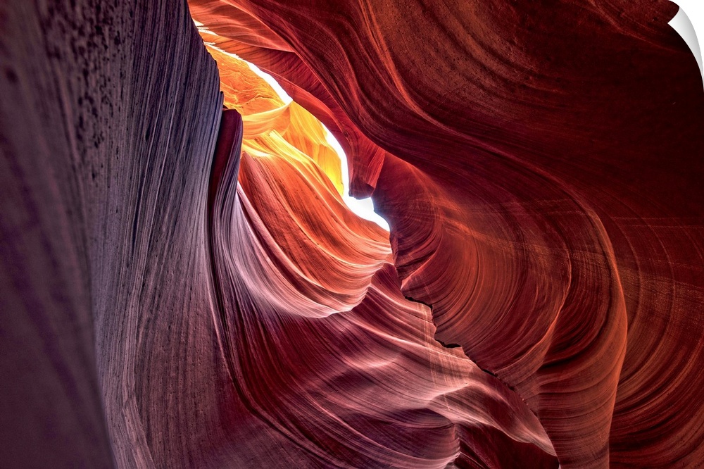 Photograph from inside of Antelope Canyon rock formation located on the Navajo Reservation in Page, Arizona with colorful ...