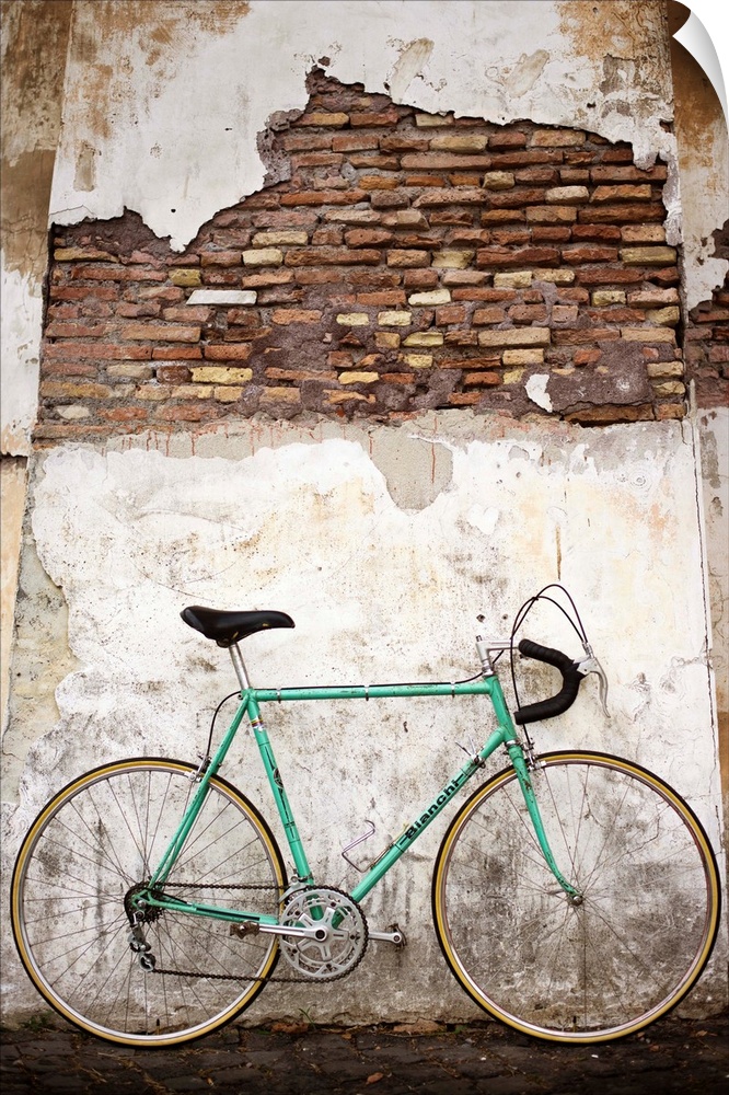 Photograph of a bicycle leaning up against an old wall in Rome.