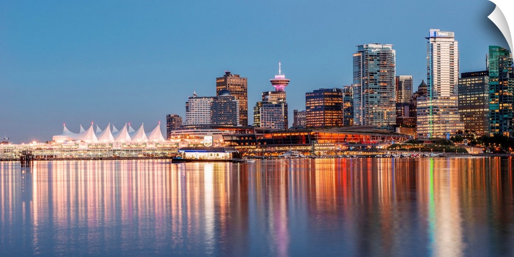Bright reflections of Vancouver skyline during sunset in British Columbia, Canada.